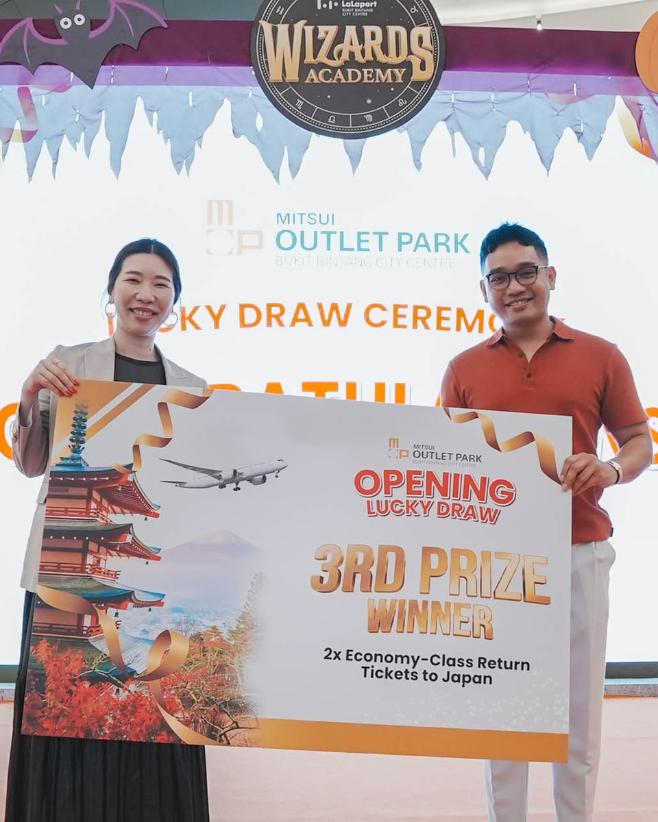 Joyful winners displaying their prizes at the MOP BBCC Lucky Draw Ceremony.