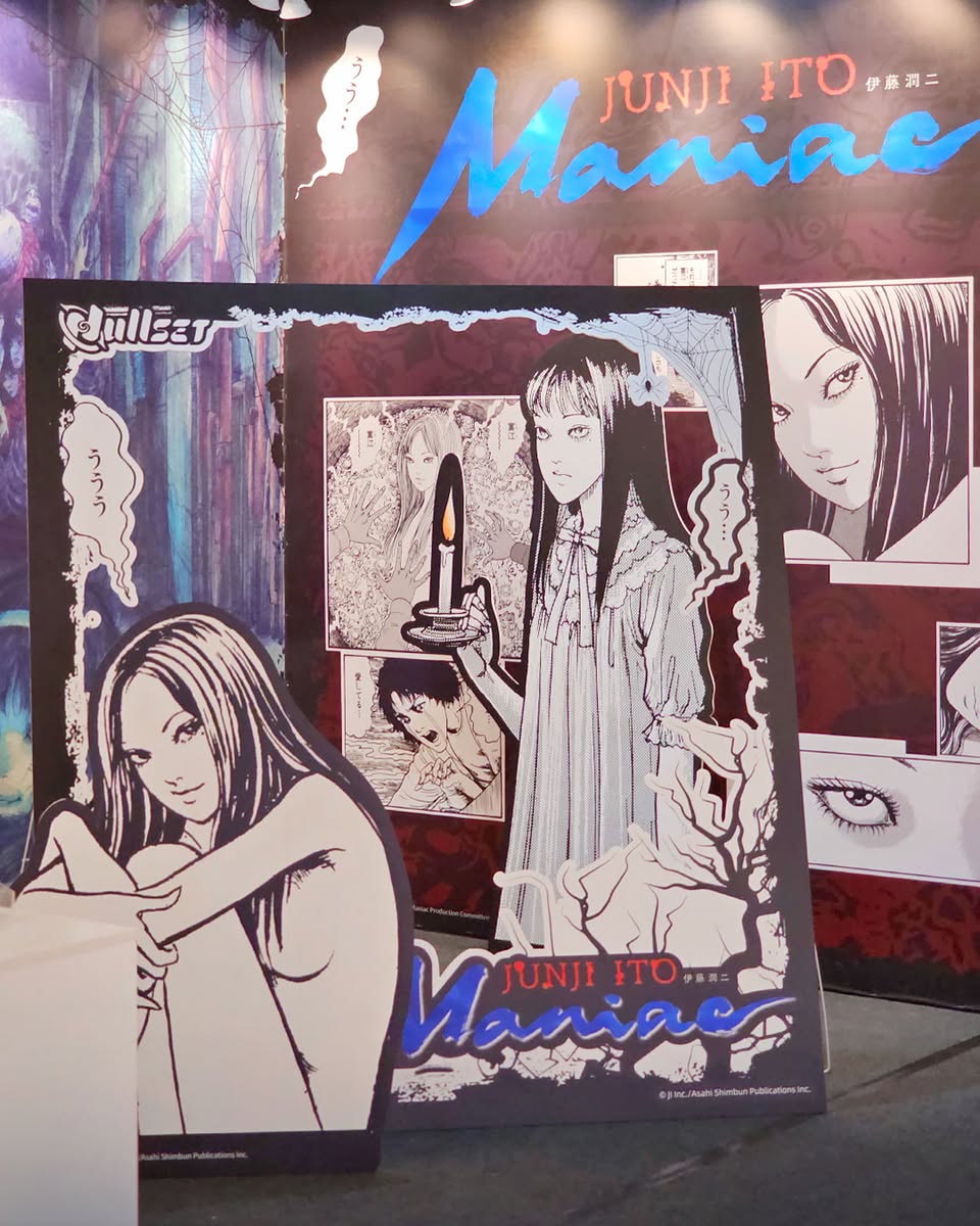 Enthusiastic fans exploring the various Junji Ito themed products at the Nullset event.