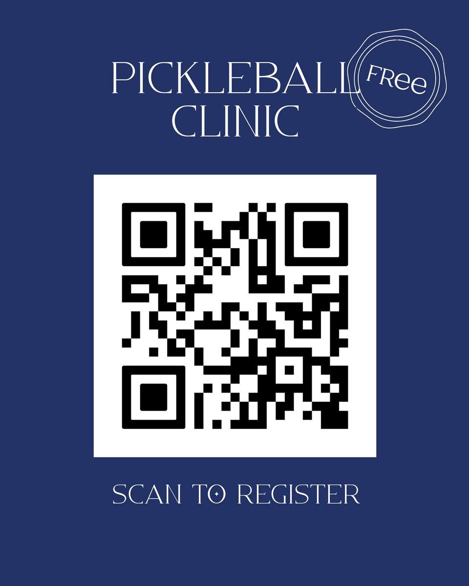 Kids playing pickleball on a court.