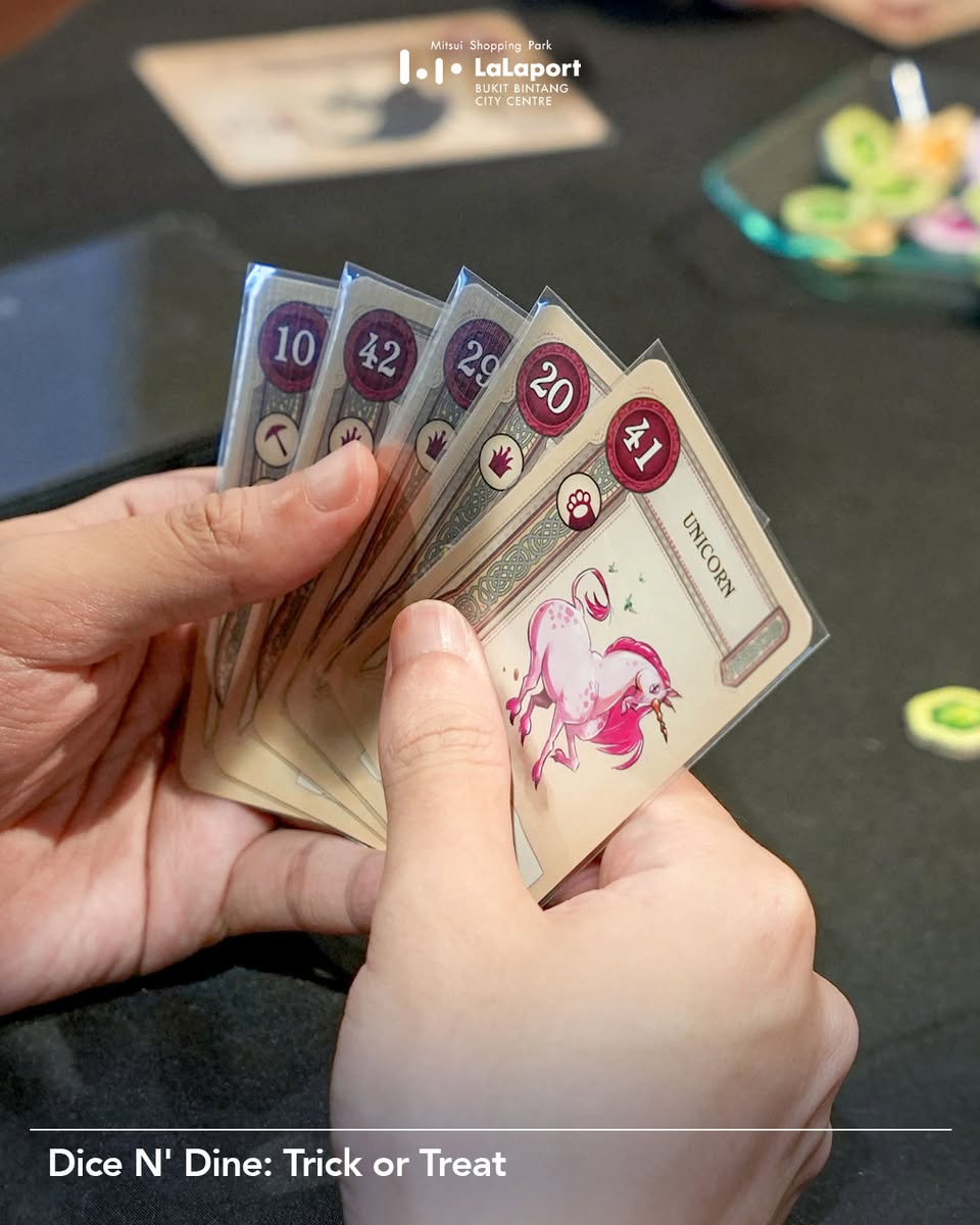 A group of friends laughing and interacting during a board game