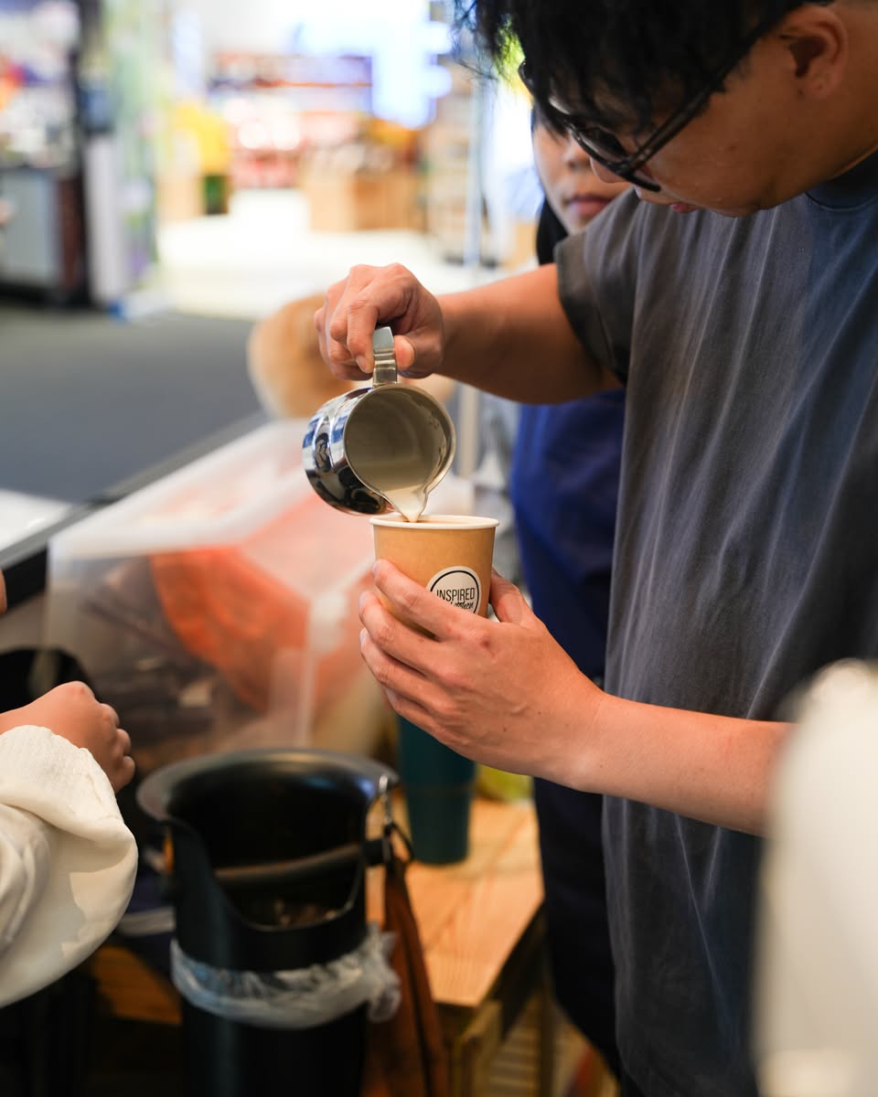Experts demonstrating coffee brewing techniques at a workshop