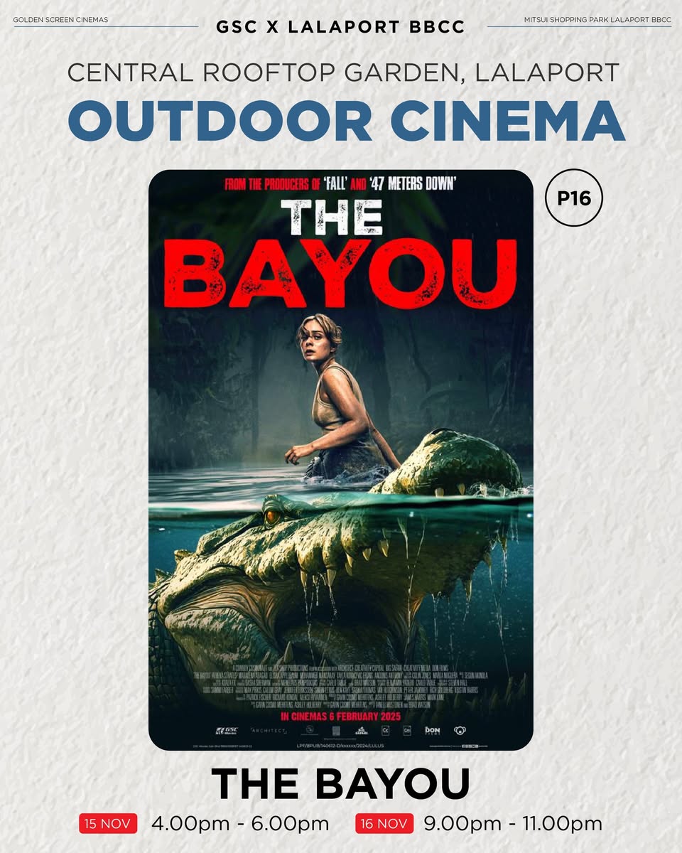 A vibrant outdoor movie screening event at night, with people enjoying the show.