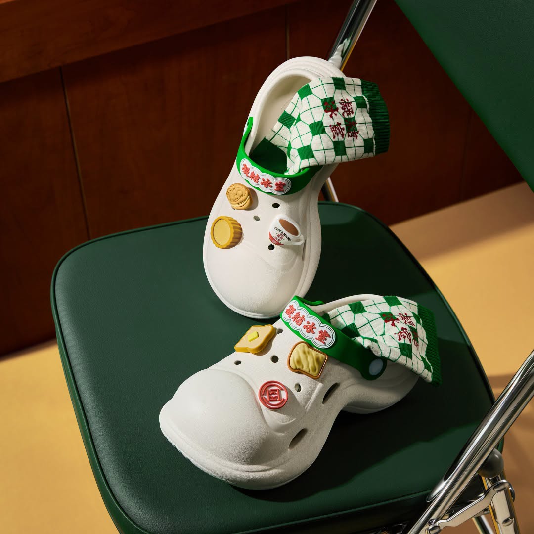 White clogs with green-and-white checkered fabric and Chinese character detailing