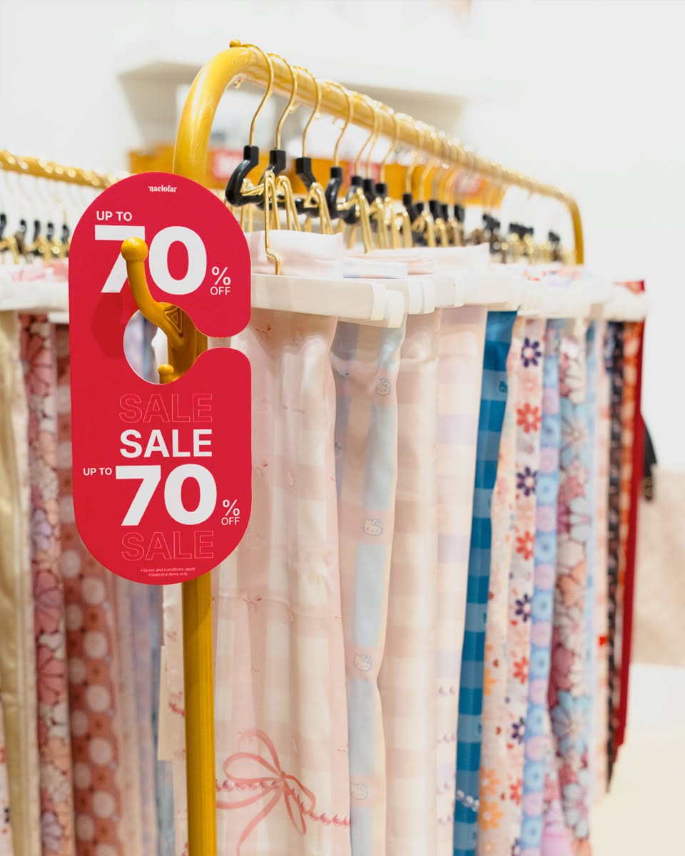 Close-up of Naelofar's chic scarf collection on display