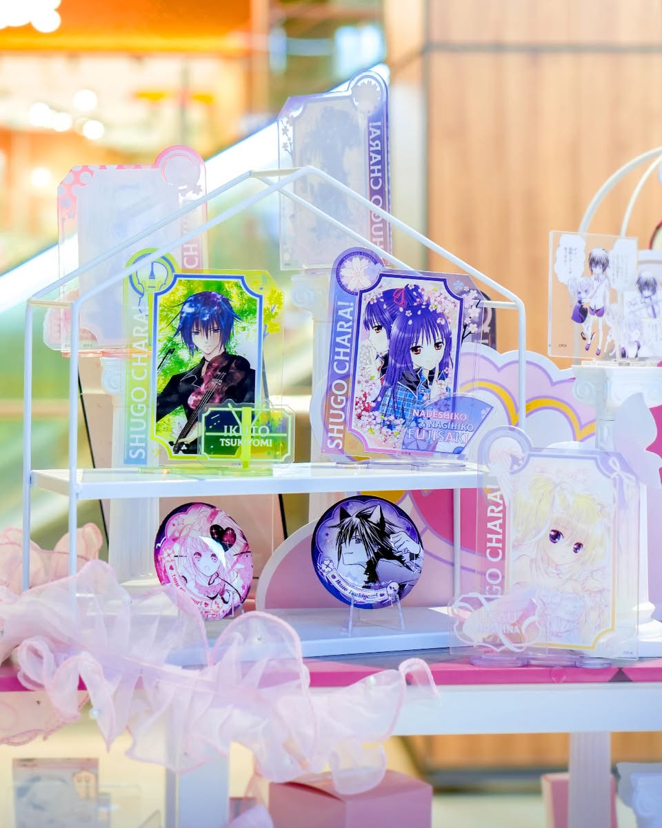 Artists engaging with attendees and presenting their doujin works