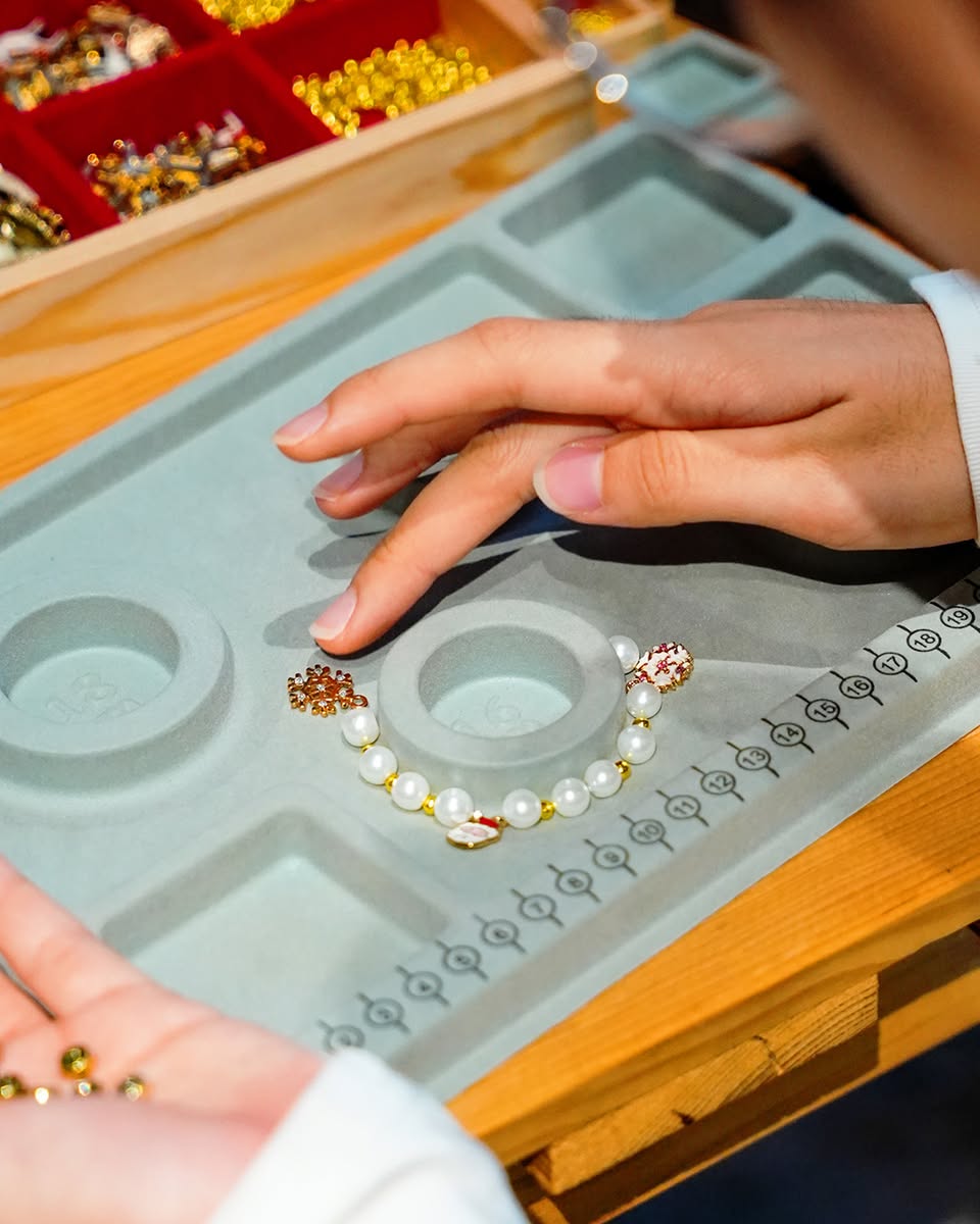 DJ performing at a vibrant night market during holiday festivities