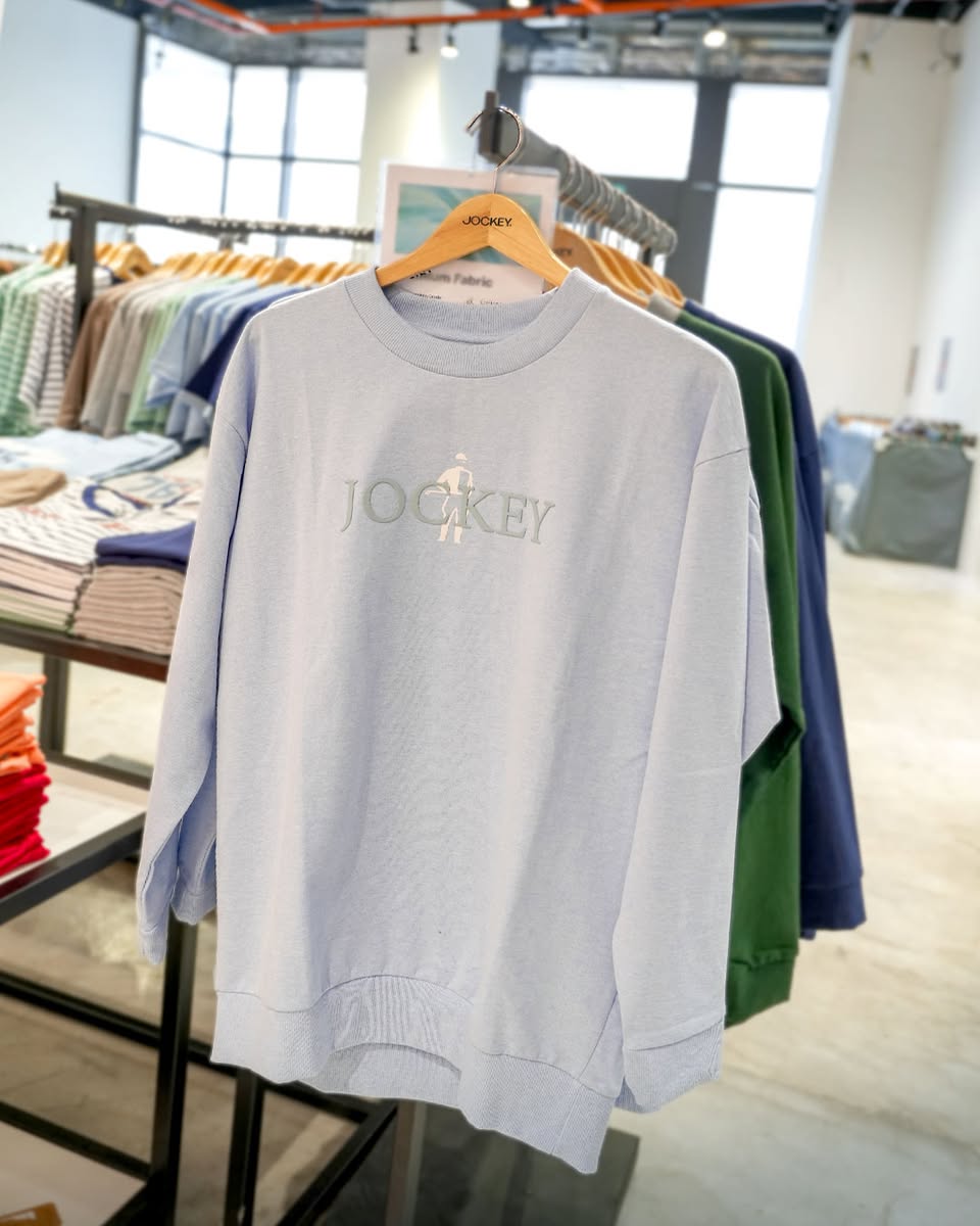 Assortment of stylish bags and wallets available at the pop-up event.