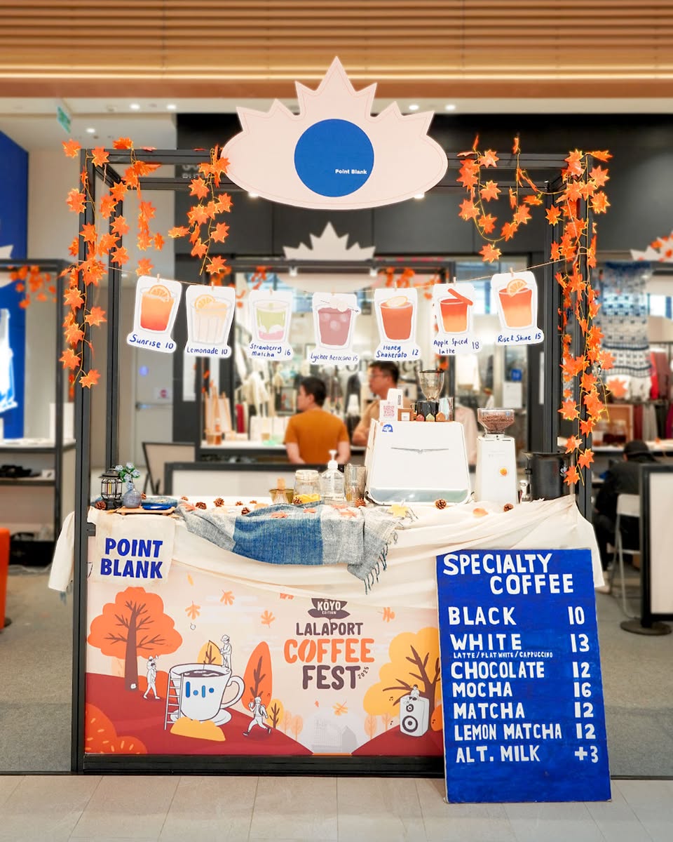 A beautifully crafted autumn-themed coffee drink with seasonal garnishes