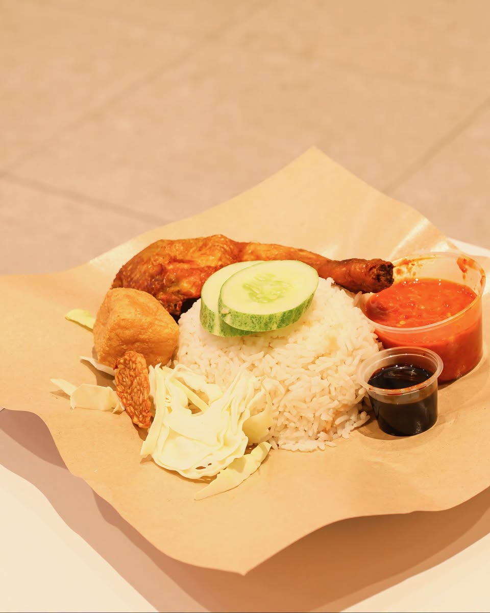 Ayam Gepuk Ombak fried chicken rice plate with condiments