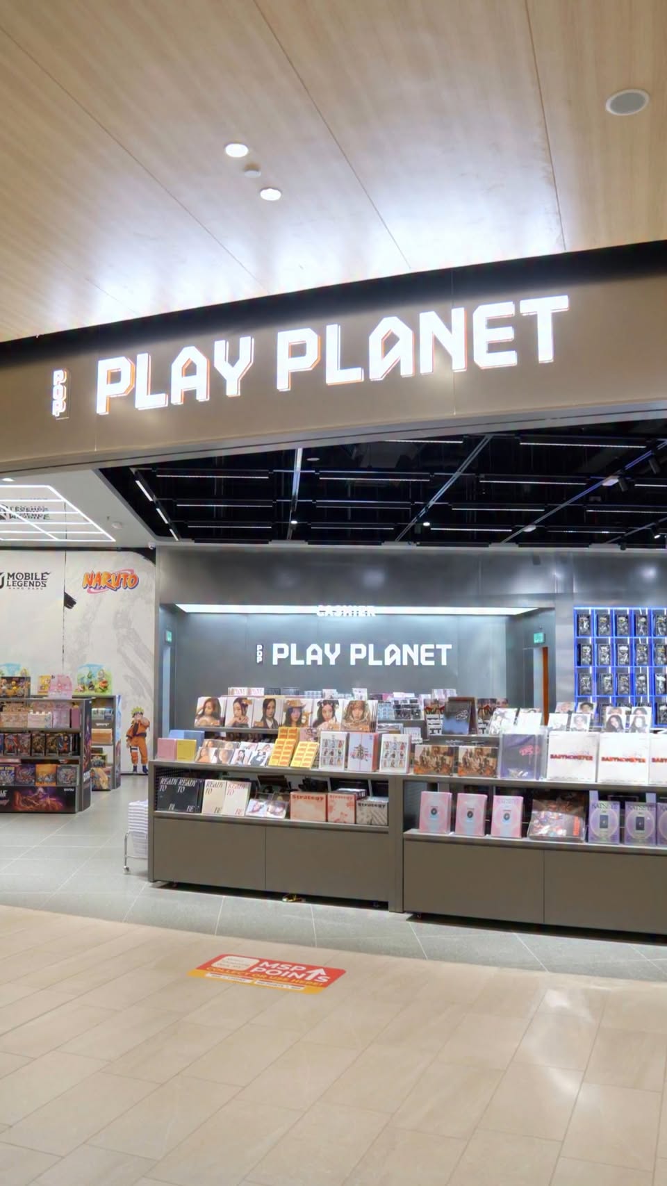 Pop Play Planet store display with anime figurines and collectibles