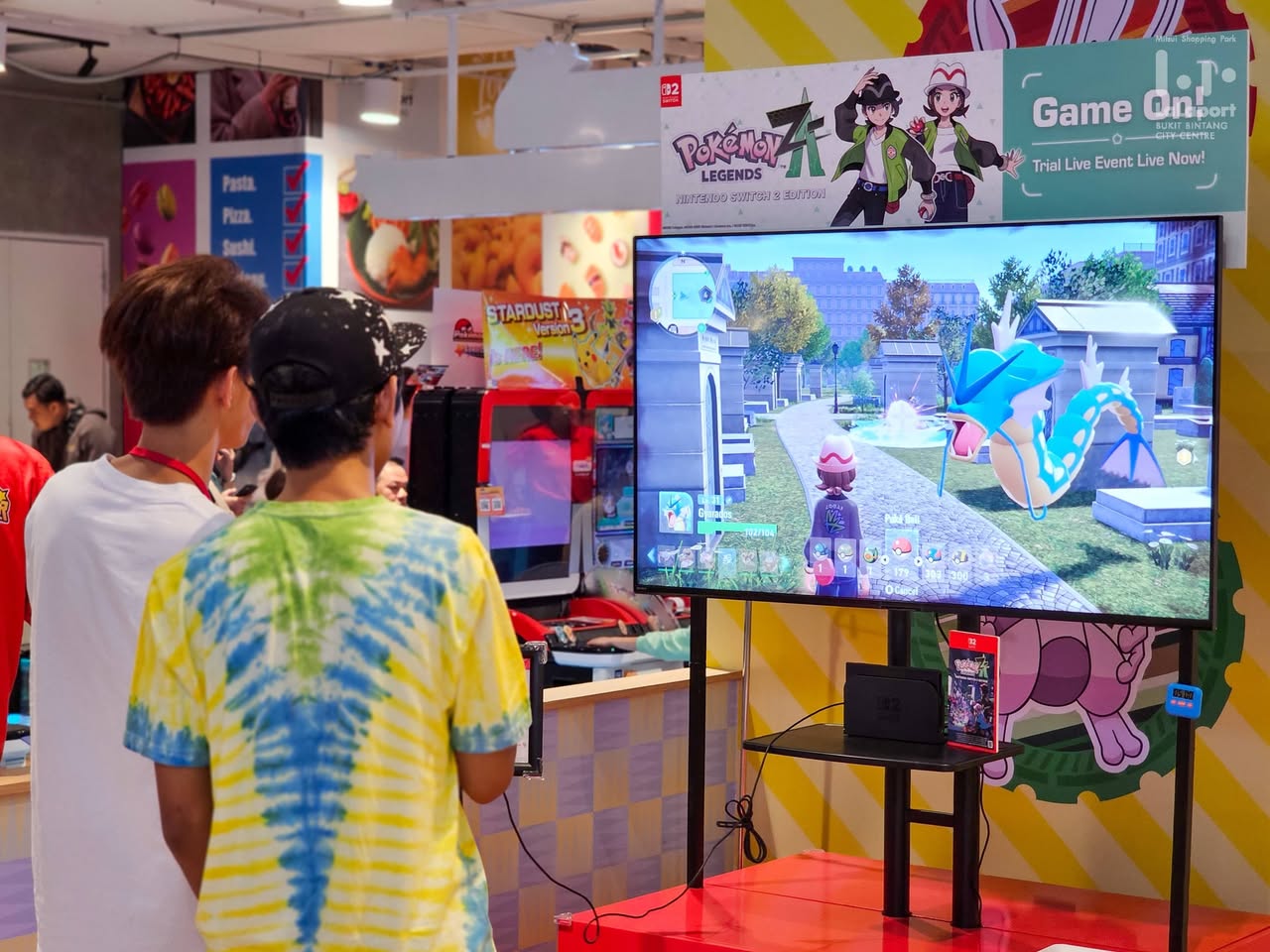 People posing with Pokémon characters