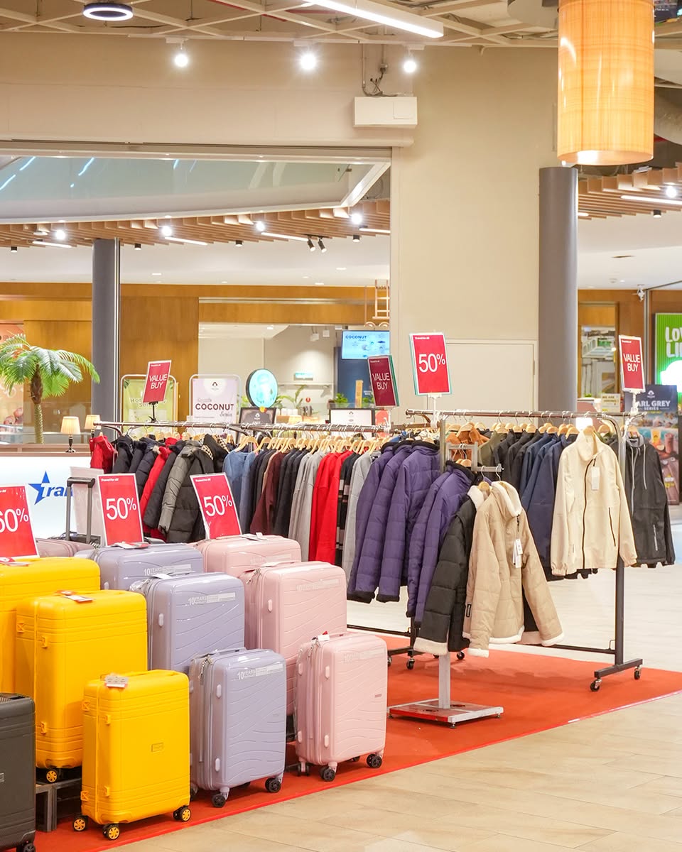Travel essential wear and accessories showcased in the atrium