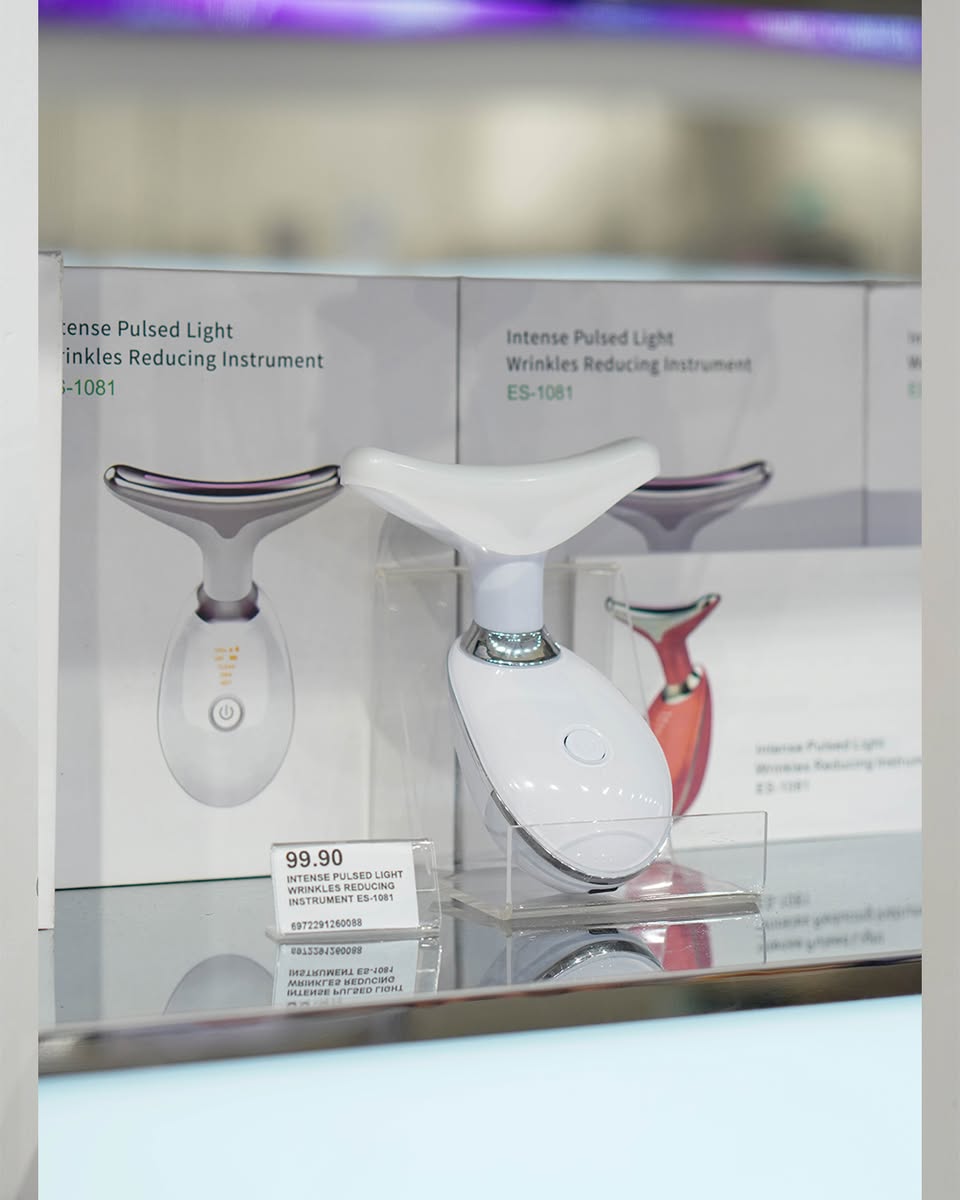 Shoppers exploring a vibrant display of K-beauty products at OnlyKorea's grand opening.