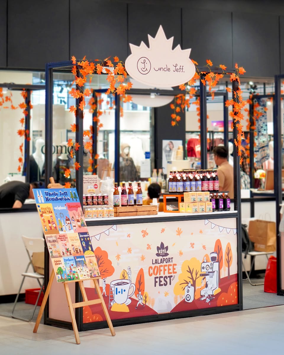 A barista demonstrating latte art in a coffee workshop setting
