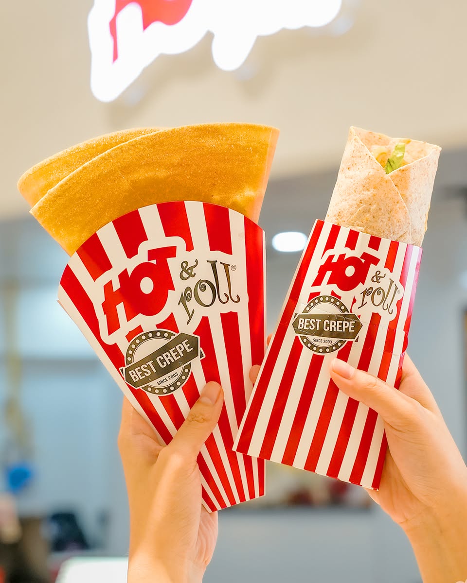 A close-up of a delicious, hot pizza slice with melting cheese.