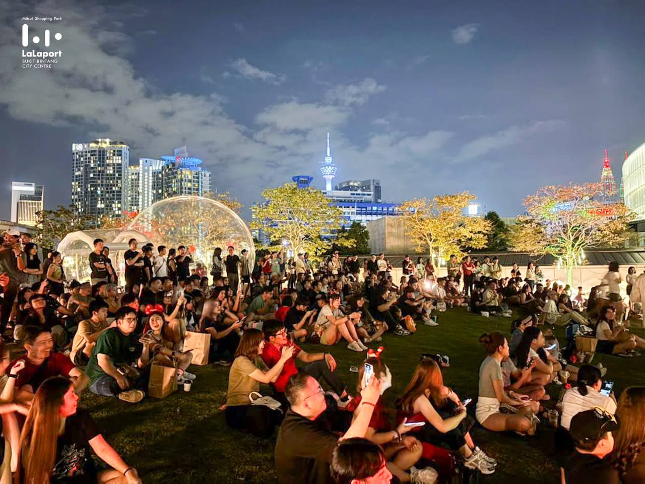 Overhead view of the Jingle Jam venue, showing vendor stalls and attendees.