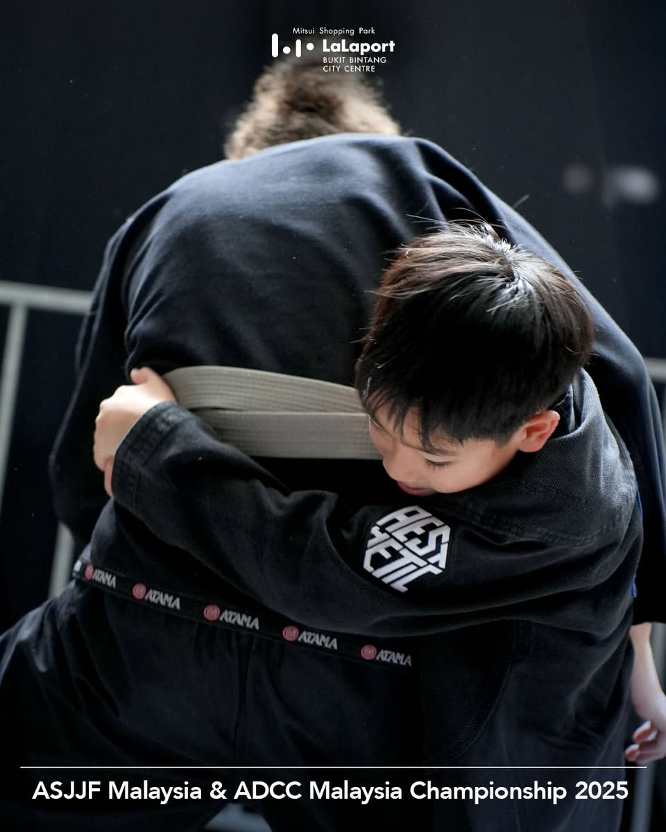 Brazilian Jiu-Jitsu practitioner demonstrating a move at WoW Plaza showcase