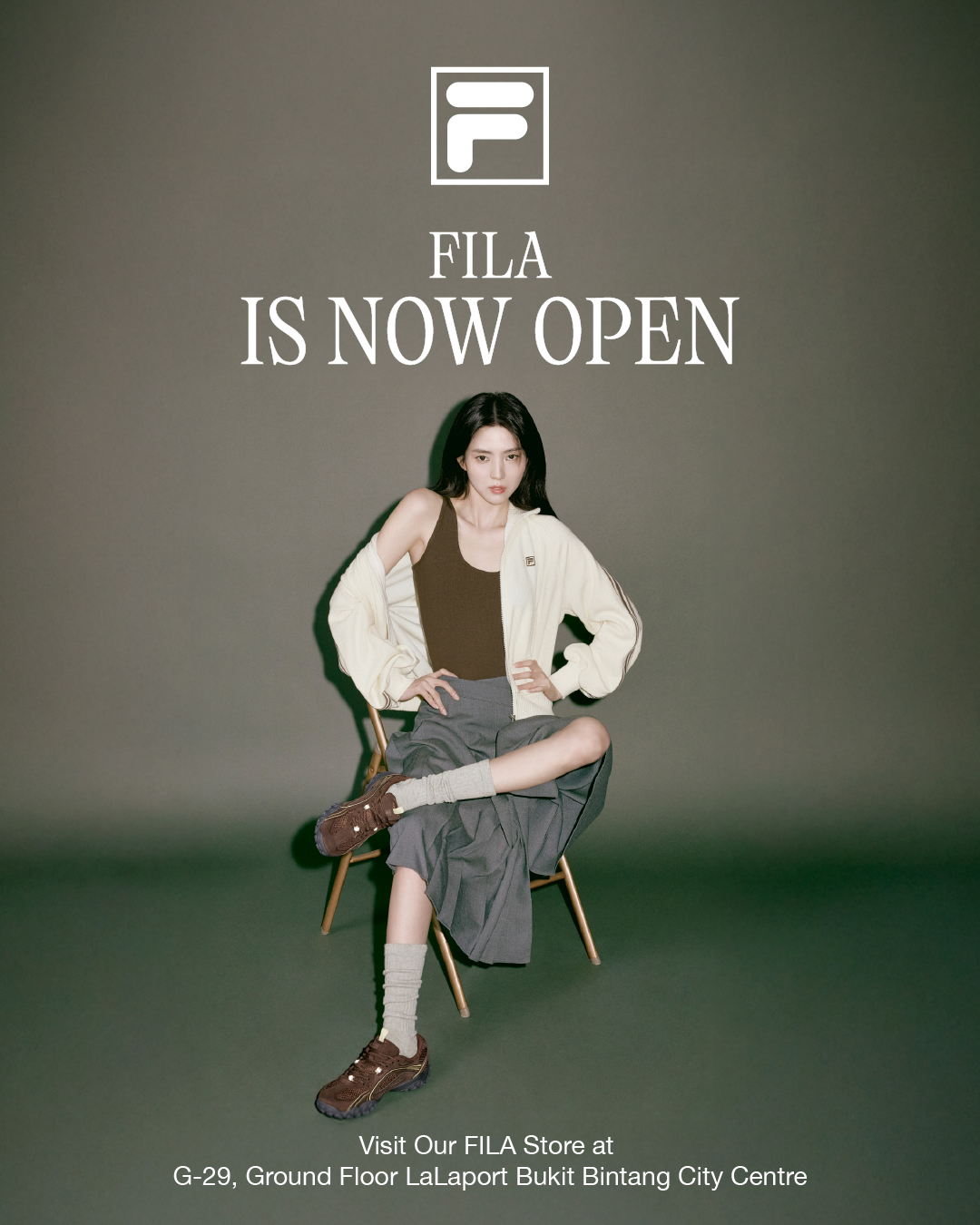 A stylish display of FILA apparel and footwear, showcasing modern and classic designs.