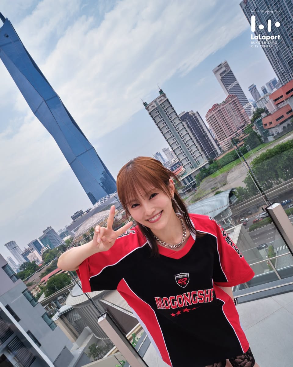 Selfie-style photo with urban skyline from LaLaport rooftop terrace