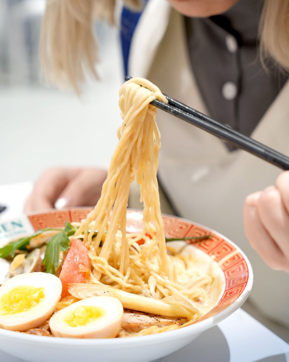Assortment of ramen bowls and sides from Torigen Chicken Ramen