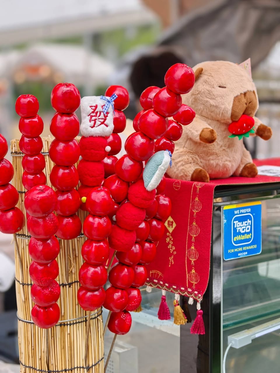 Touch n Go eWallet rewards with tanghulu candies and capybara plush toy