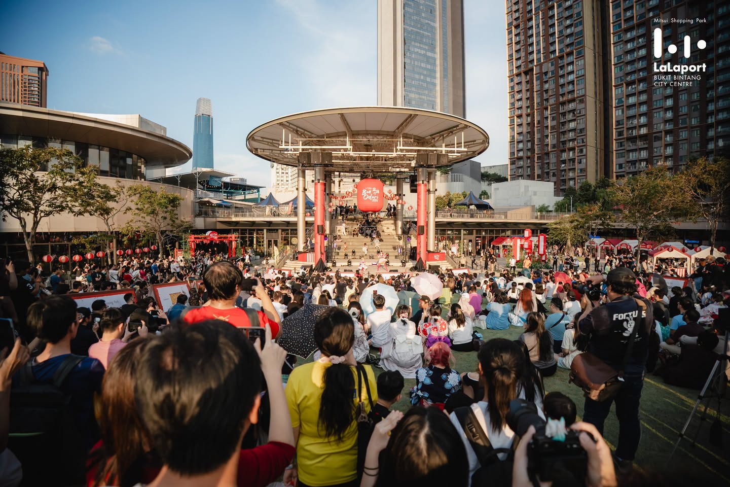Crowd gathered around stage at dusk during LaLaport Bon Odori 2026