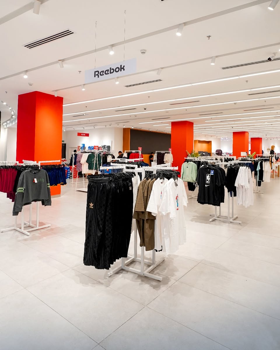 Sportswear neatly arranged on racks, highlighting various popular brands available.