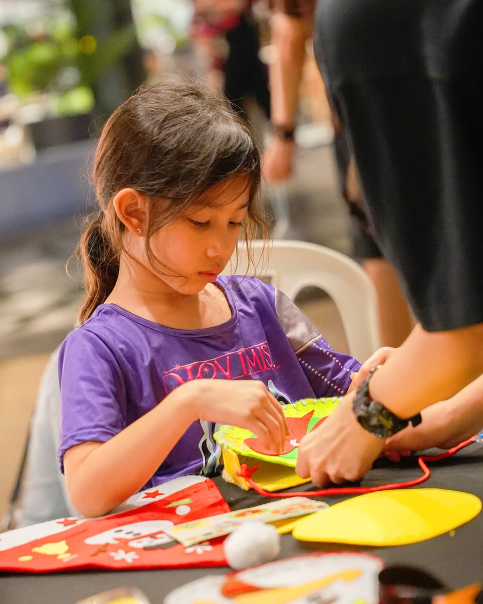 Rooftop Christmas celebration with festive lights and happy faces