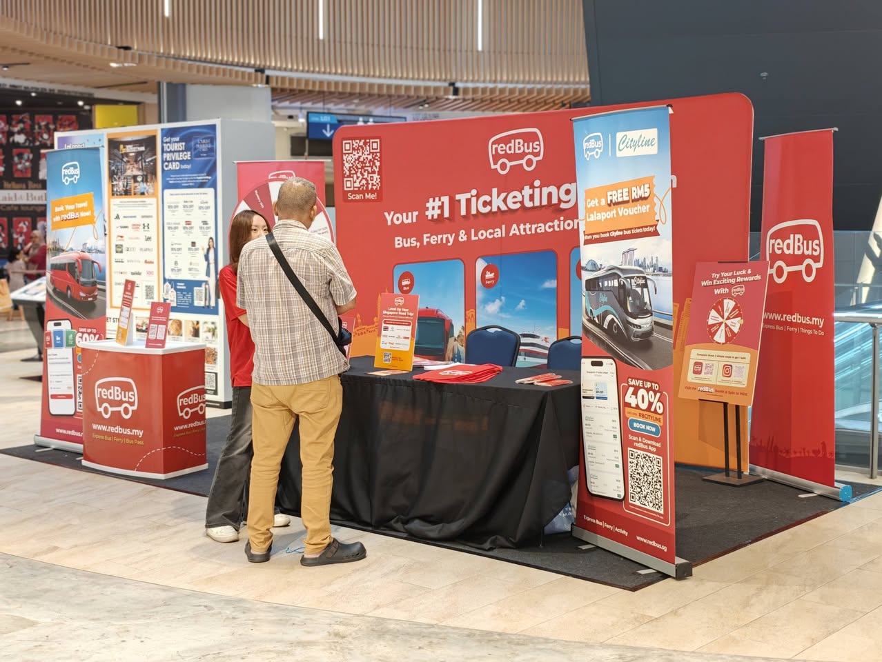 redBus banners with QR codes and airport voucher offer