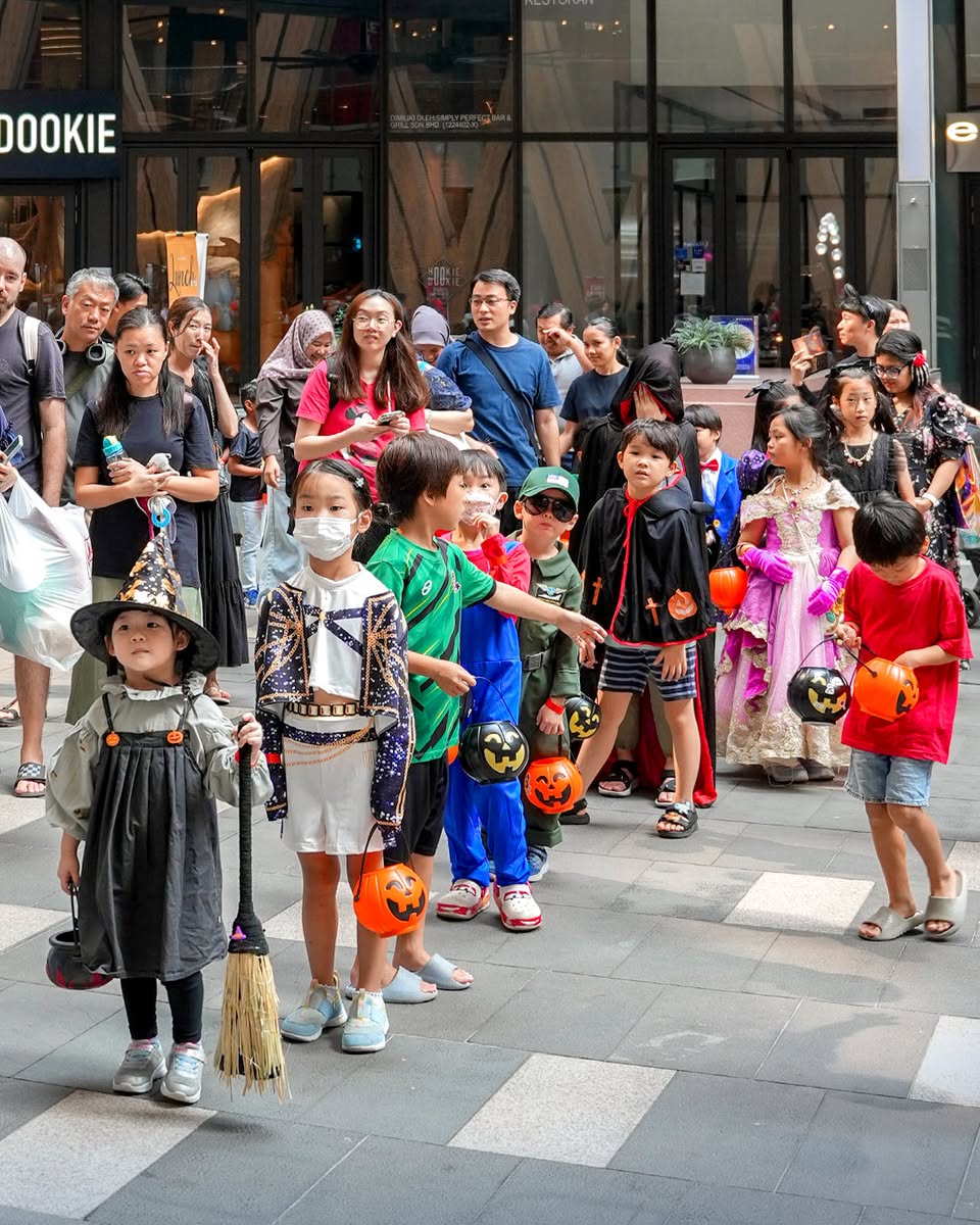 Families enjoying the festive atmosphere of the Trick or Treat walk.