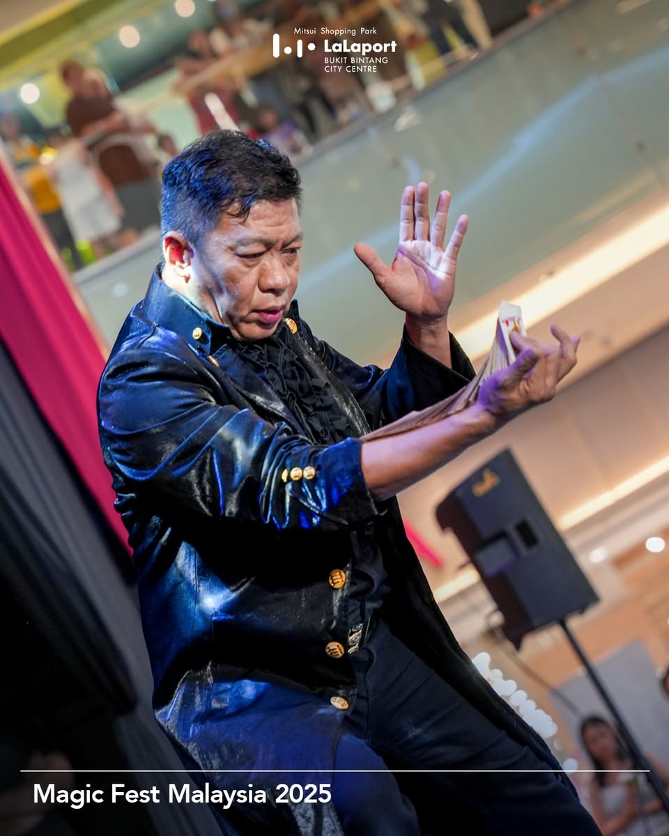 A magician performing a captivating illusion on stage for an audience.